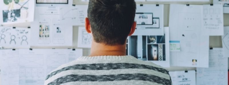 Man looking at board